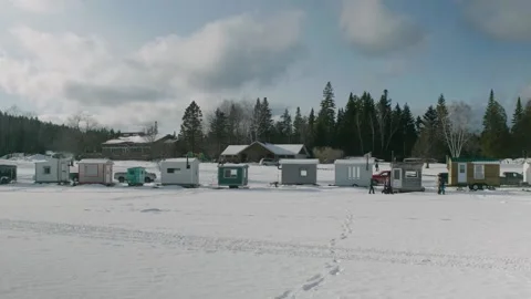 Row Of Tiny Ice Huts On Frozen White Lake Megantic In Quebec. Slow Motion Stock Footage 153444006