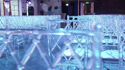 A row of transparent chairs 스톡 동영상 274467574