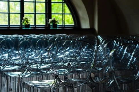 Row of transparent plastic chairs Stock Photos