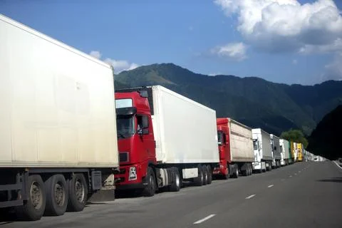 Row of trucks on the road. Stock Photos