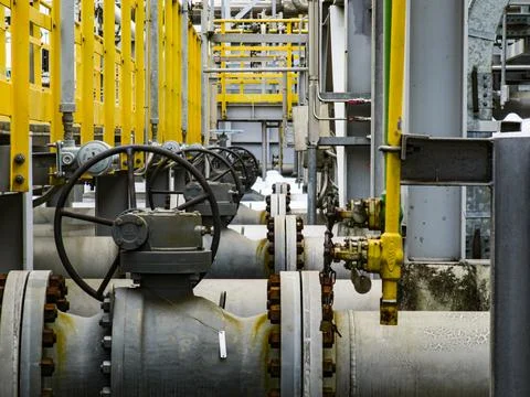 Row of valves are on a pipe Stock Photos