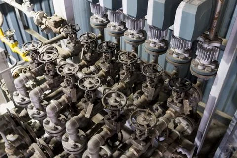 Row of valves are on a pipe Stock Photos