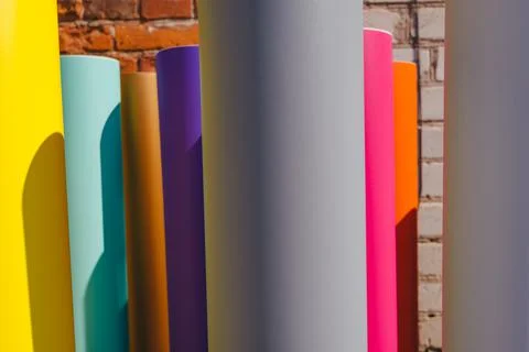 Row of various colored vinyl car wrapping or plotter cutting sticker foil fil Stock Photos