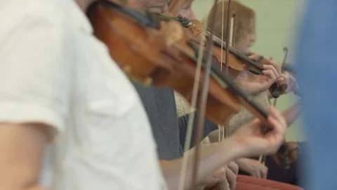 Row of Violin players Stock Footage 82883301