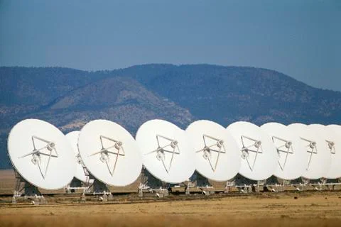 Row of VLA Very Large Array radio telescope dishes 写真素材