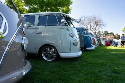 Row of Volkswagen Buses Viewed from the Front Right Side and Some Windows Open Stock Photos