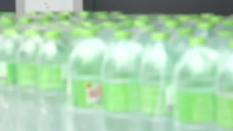 A row of water bottles are on a shelf Stock Footage 289322598