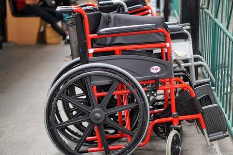 A row of wheelchairs provided for accessibility services for disabled Stock Photos