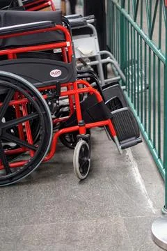 A row of wheelchairs provided for accessibility services for disabled Stock Photos