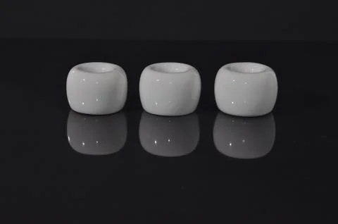 Row of white ceramic cylinders Stock Photos