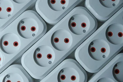 Row of white electrical outlets with red and black accents Stock Photos