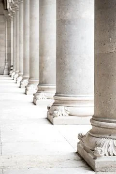 Row of white marble columns. Vertical image Stock Photos