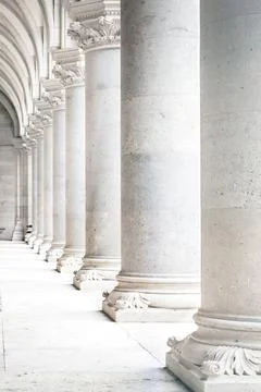 Row of white marble columns. Vertical image Stock Photos
