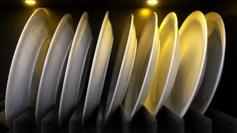 Row of white plates on black Stock Footage 87195902