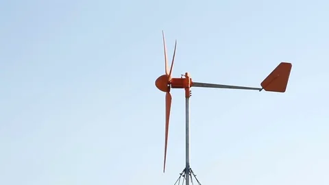 Row of wind power generator over blue sky Stock Footage