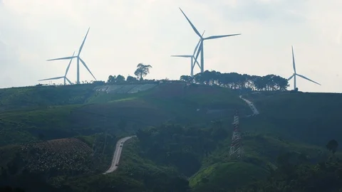 Row of wind power generators on blue background Stock-Footage 99485884
