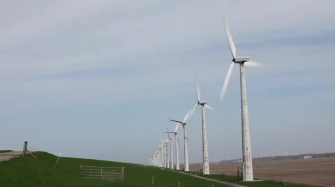 Row of windmills on Dike Stock Footage 39018123
