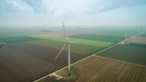 Row of Windmills in Empty Field Misty Weather, Flevoland, Netherlands / Holland  Stock Footage 119102075