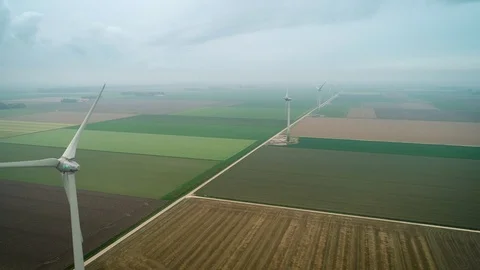 Row of Windmills in Empty Field Misty Weather, Flevoland, Netherlands / Holland  Video stock 119102138