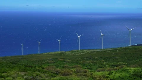 Row of windmills turning , wind power turbines generating clean renewable energy Stock Footage 89916058