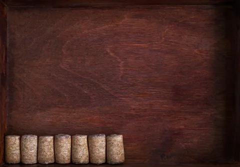 Row of wine corks into dark box Stock Photos