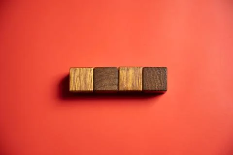 Row of wooden square cubes on colored background. Template or Copy space Stock Photos