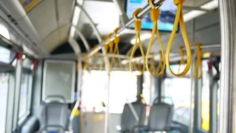 A row of yellow handle on a bus Vidéo 274517721