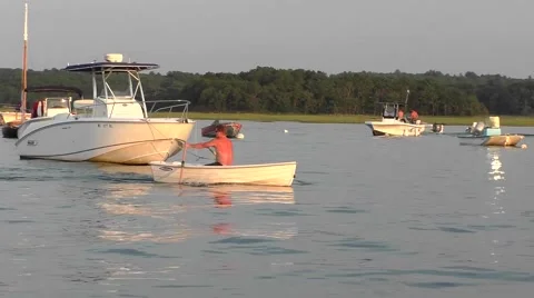 Rowboat skiff, man rowing down river Stock Footage 67327888