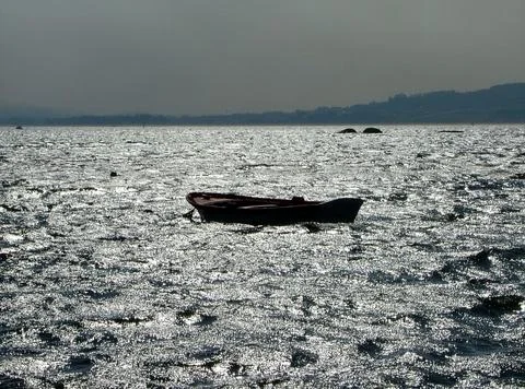 Rowboat at sunset Stock Photos