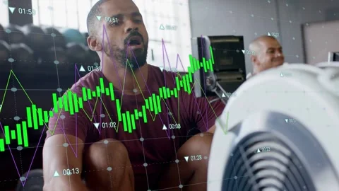 Rower in maroon initiating steady strokes on machine, overlaying fitness graphs Stock Footage 332867078