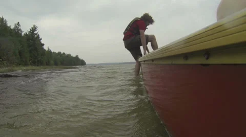 Rower mounting on a canoe Stock Footage 39652752