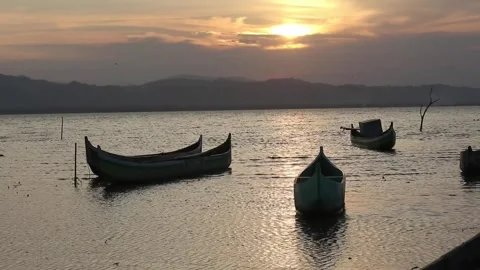 Rowing boat floating over the Limboto Lake waters Stock-Footage 254457145