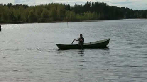 Rowing Boat Floats on the Lake Stock Footage 11058682