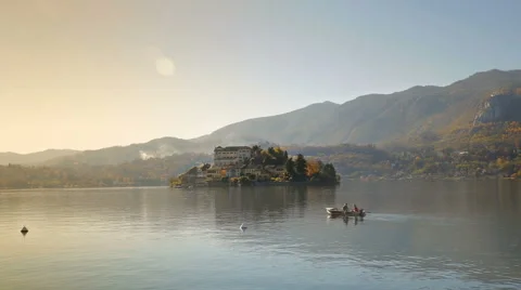 Rowing boat in front of San Giulio island on Lake Orta Stock Footage 59862899