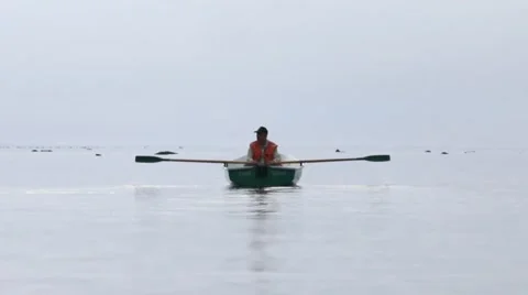 Rowing boat on the horizon Stock Footage 58337607