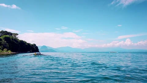 Rowing Boat racing in Competition along Coast with Aerial Drone. Stock Footage 324890319