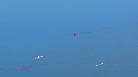 Rowing Boat racing in Competition along Coast with Aerial Drone. Stock Footage 325970568