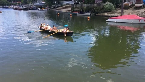 Rowing boat on the RIver Thames, Eel Pie Island, Twickenham, London, UK Stock Footage