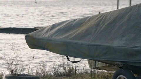 Rowing boat under cover during the winter months in very windy weather, Hornsea Stock Footage 123971825