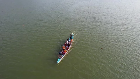 Rowing competition team training at Lake Sermo Kulon Progo Stock Footage 214540940