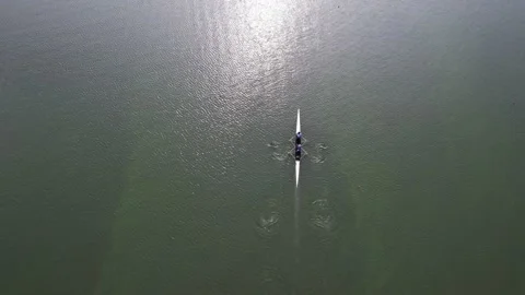 Rowing competition team training at Lake Sermo Kulon Progo Stock Footage 214549653