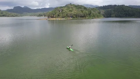Rowing competition team training at Lake Sermo Kulon Progo Stock Footage 214555080
