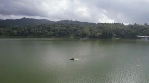 Rowing competition team training at Lake Sermo Kulon Progo Stock Footage 214585103
