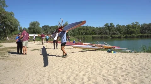 Rowing competitions sport beach river spectators Stock Footage 139280490