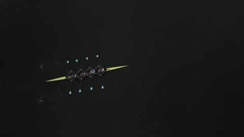 Rowing Crew Glides Across a Dark Lake at Dusk in Gent, Belgium Stock Footage 279379749