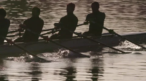 Rowing Crew Silhouette in Sunlight - Slow Motion Stock Footage