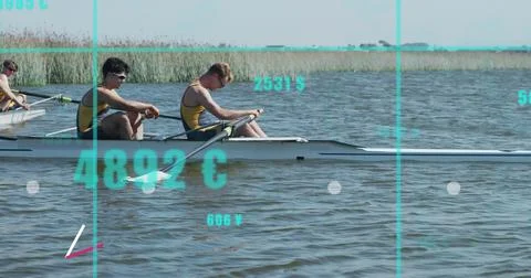 Rowing crew in yellow singlets powering on lake near reeds in shell with oars, Stock Photos