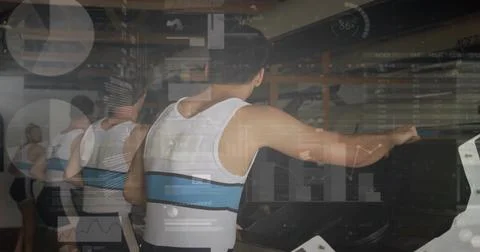 Rowing male athlete pulling ergometer handle from back at gym, wearing white Stock Photos