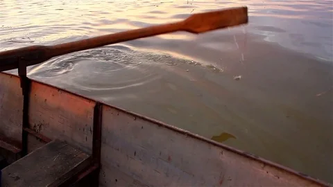 Rowing by the old boat Stock Footage 74944907