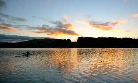 Rowing at Sunrise Stock Photos